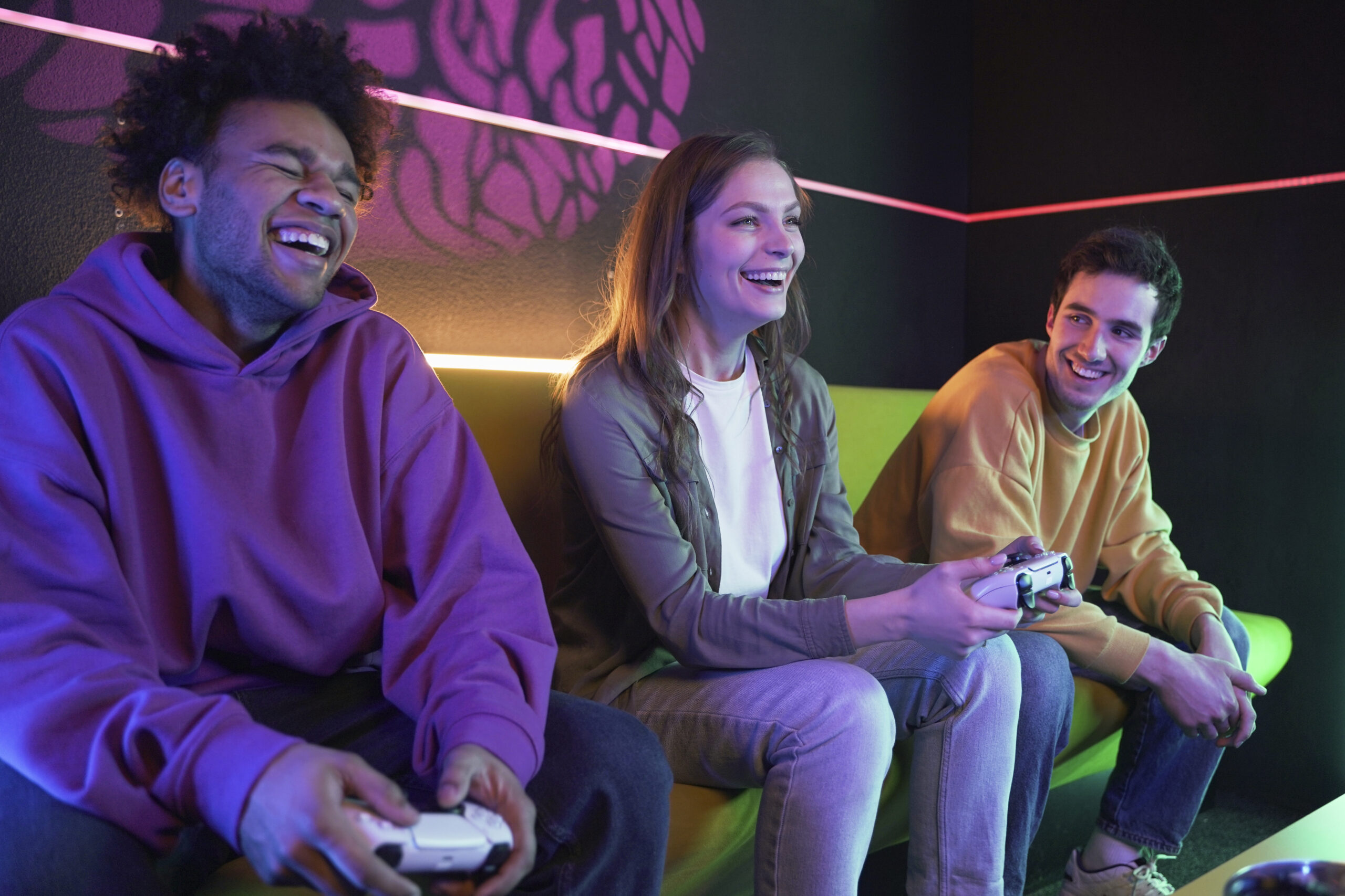 medium shot smiley friends playing videogame scaled
